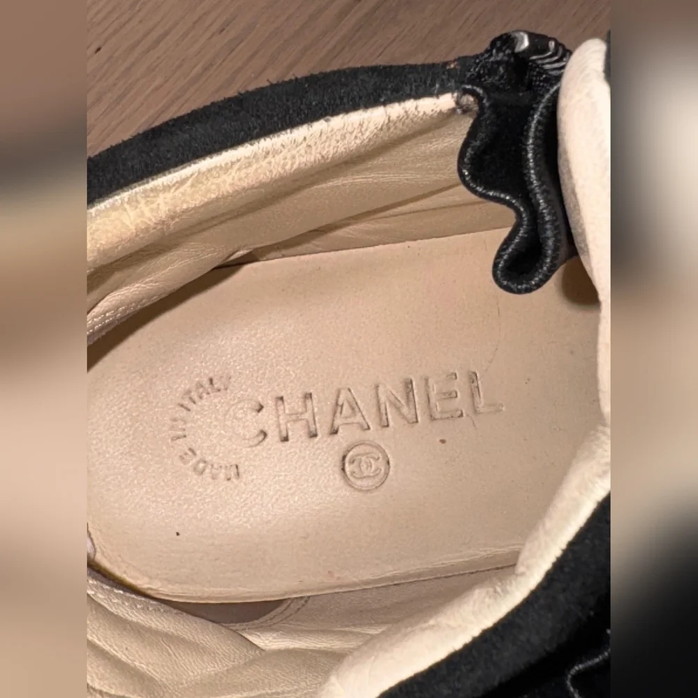 CHANEL Black High-Top Sneakers with Star Design